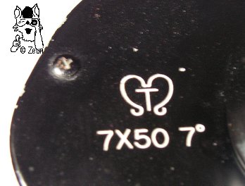 Deckel mit Tamaya Logo (T eingeschlossen durch 2 gewchwungene linie, die wie ein nach unten offenes Herz aussehen. Darunter 7x50 7°